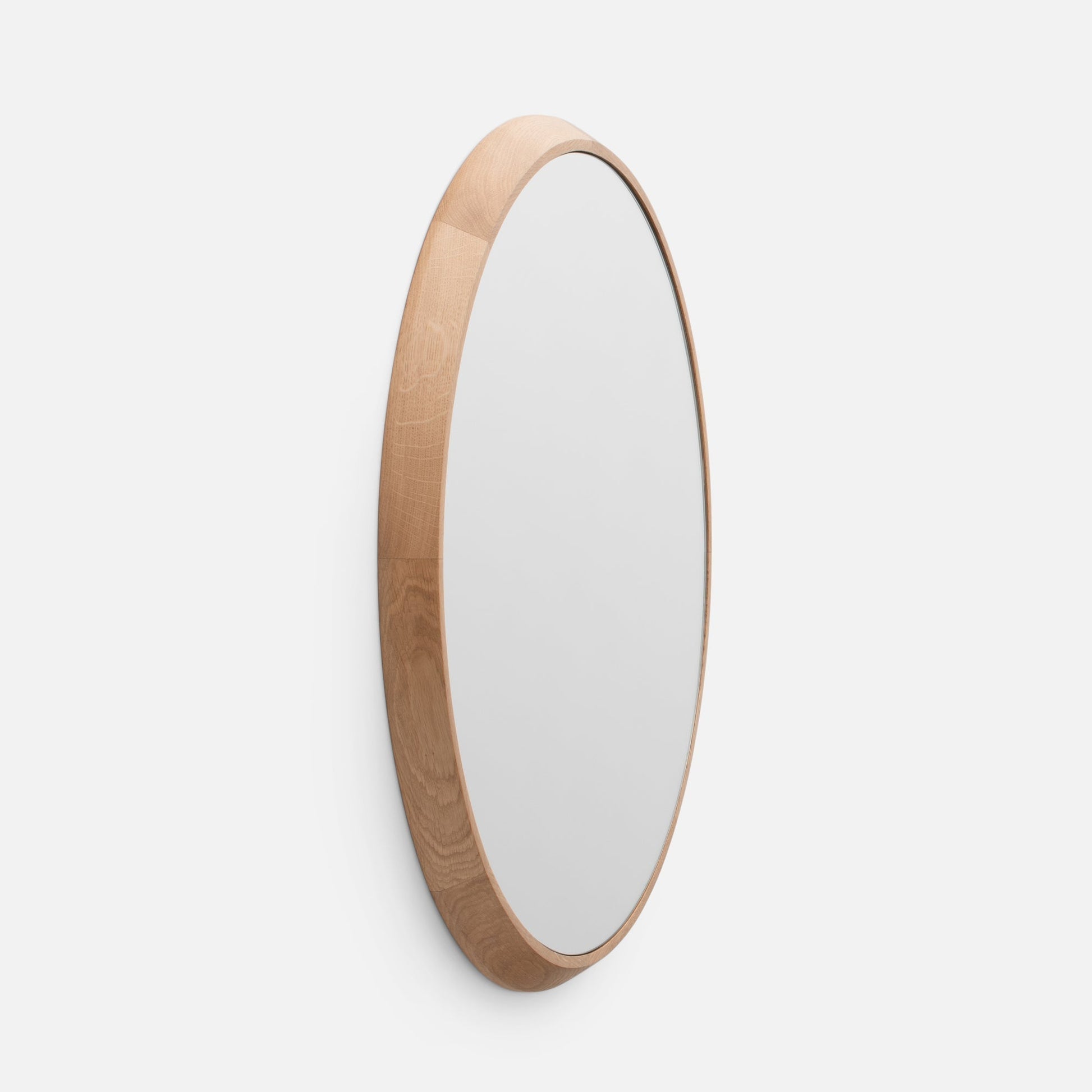 Angled close-up of Oak Chamfered Mirror showing chamfered edge and solid white oak frame against a white background