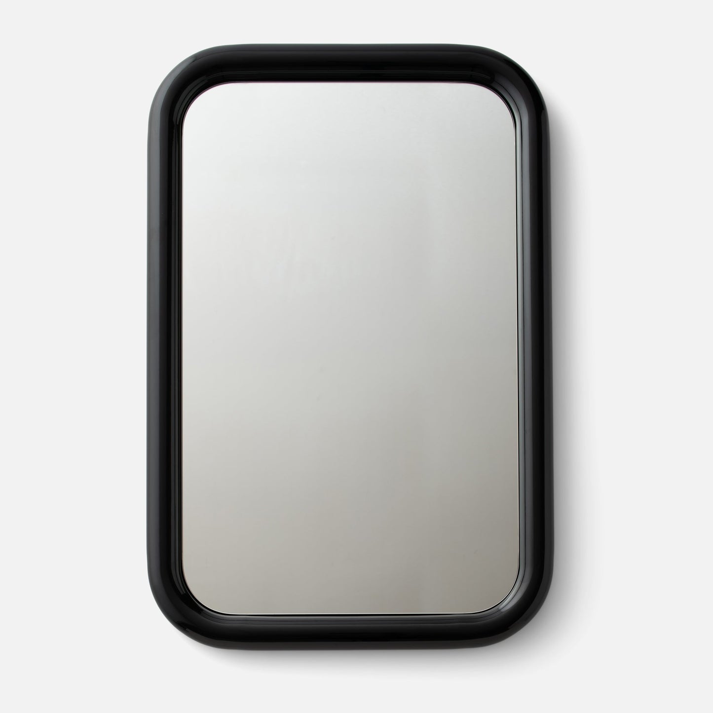 Front view of Forma Mirror showcasing rounded corners and glossy black frame on light gray background