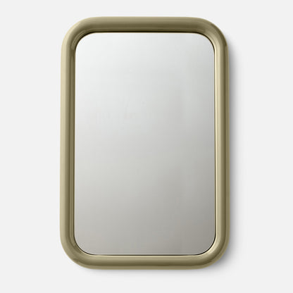 Close-up top view of Forma Mirror showcasing its rounded glossy frame on a white background
