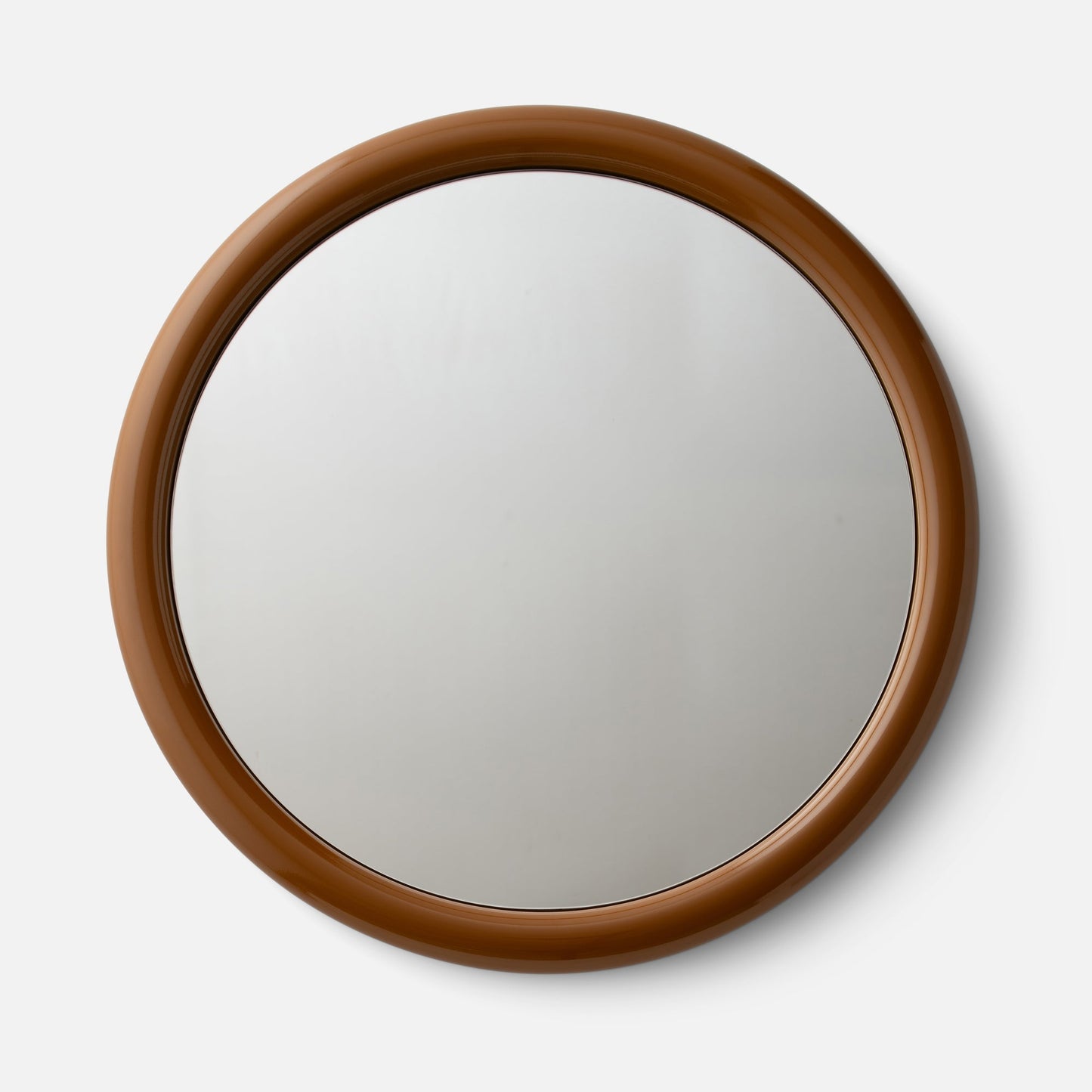 Top close-up of Forma Mirror showing glossy brown rounded frame on white background