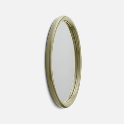 Close-up right-side view of Forma mirror showing rounded glossy olive-green frame against a white background
