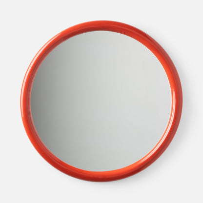 Close-up top view of Forma Mirror showcasing glossy orange-red rounded frame with white background