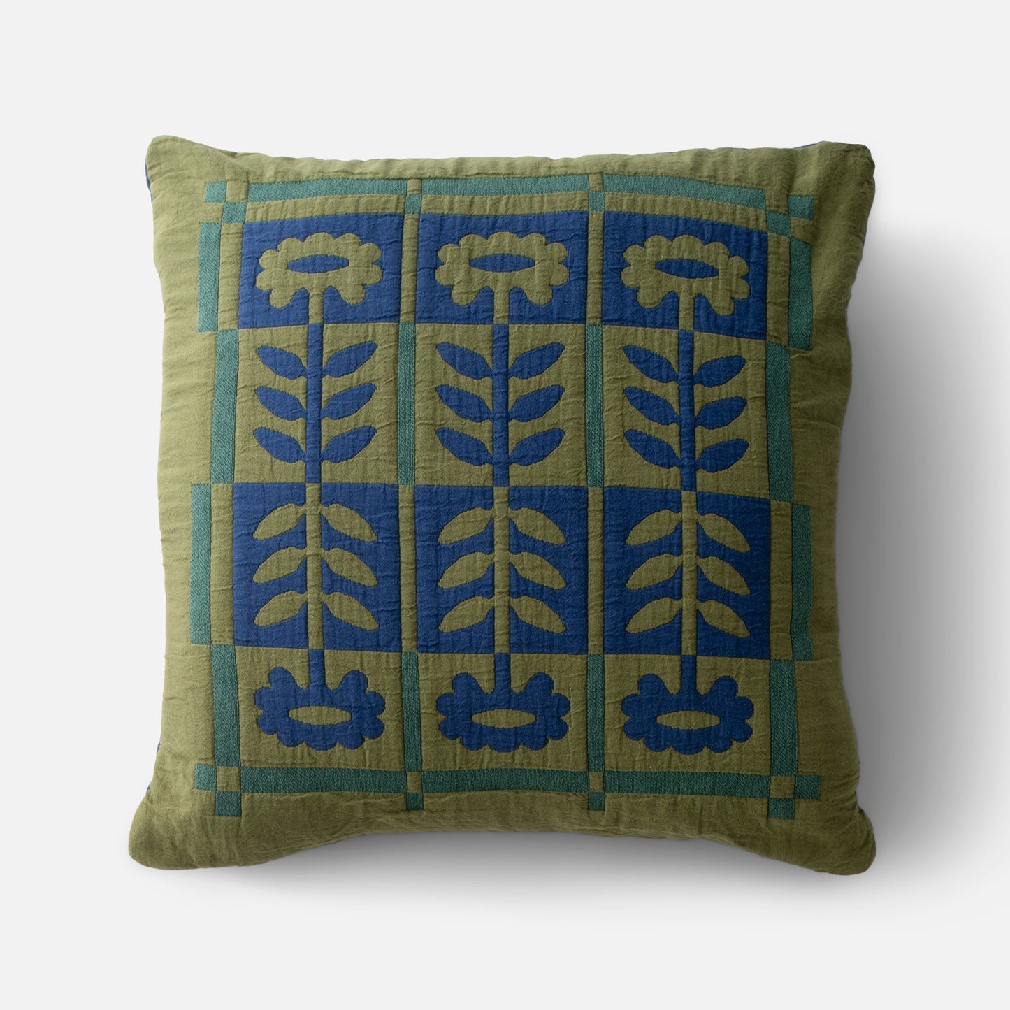 Front view of Stillwater Floral Sham showing blue mirrored floral applique and green color-blocking on 100 percent cotton with white studio background
