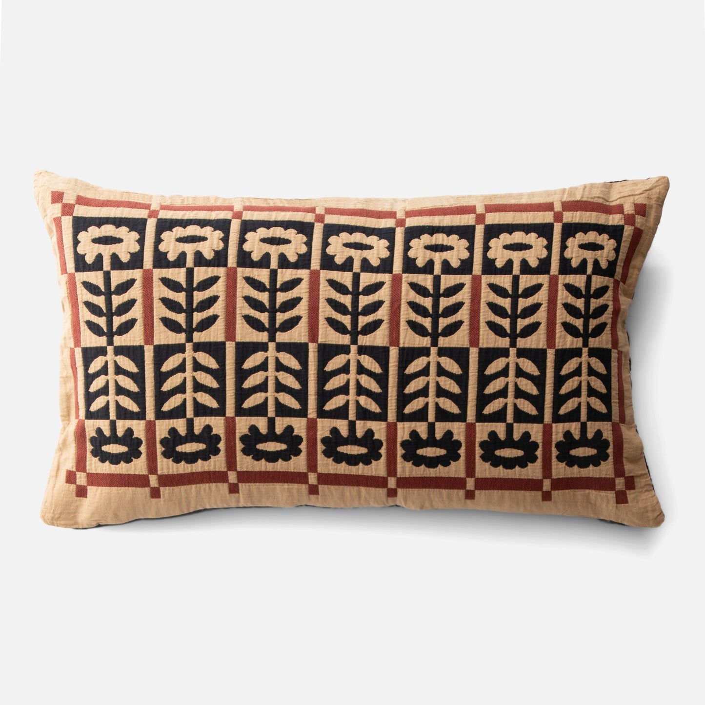 Front view of Stillwater Floral Sham with mirrored black floral applique and rust color-block grid on tan background