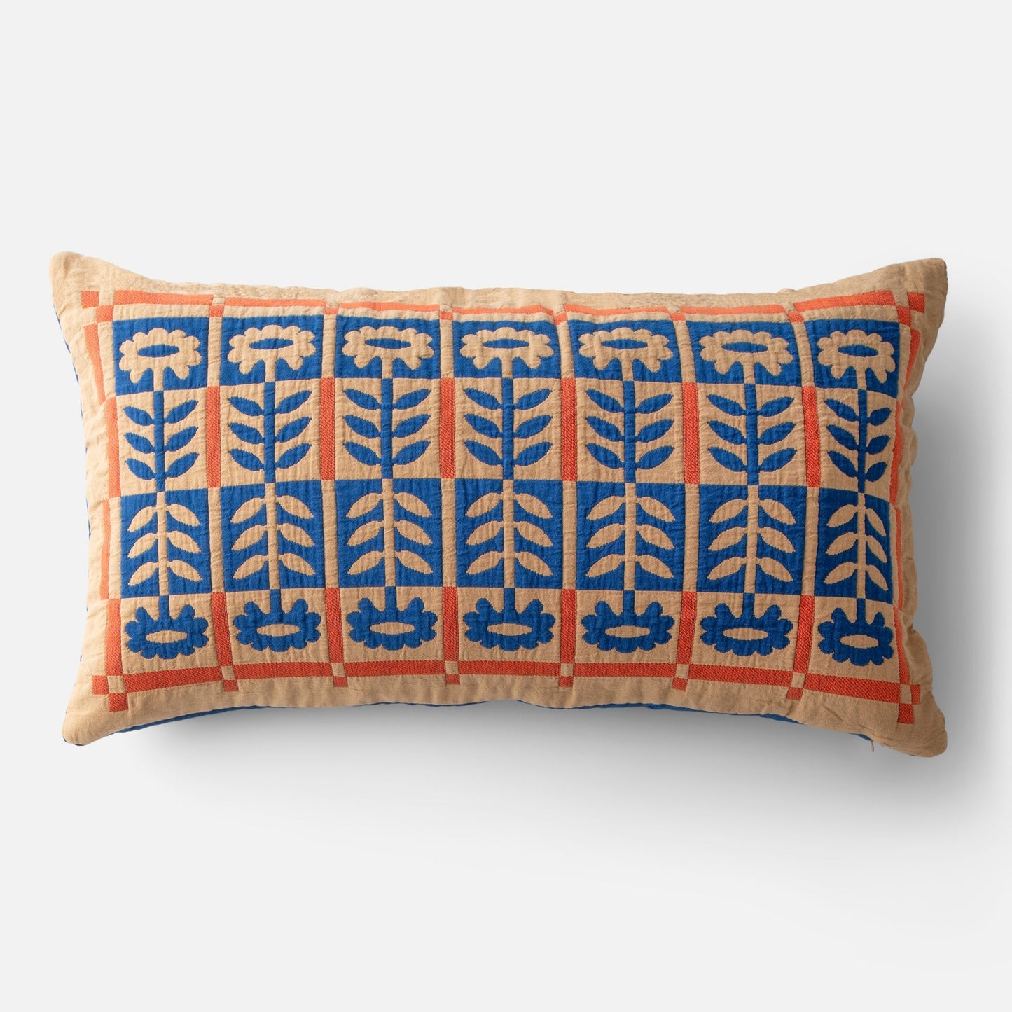 Front view of Stillwater Floral Sham showing blue mirrored floral applique and orange grid on tan cotton
