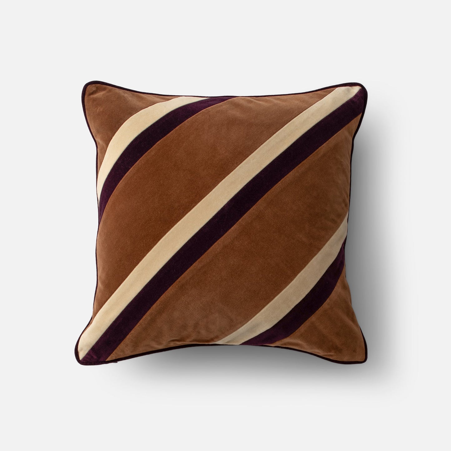 Close-up of Pieced Velvet Pillow Cover showcasing diagonal cream and plum stripes on brown velvet with gray background