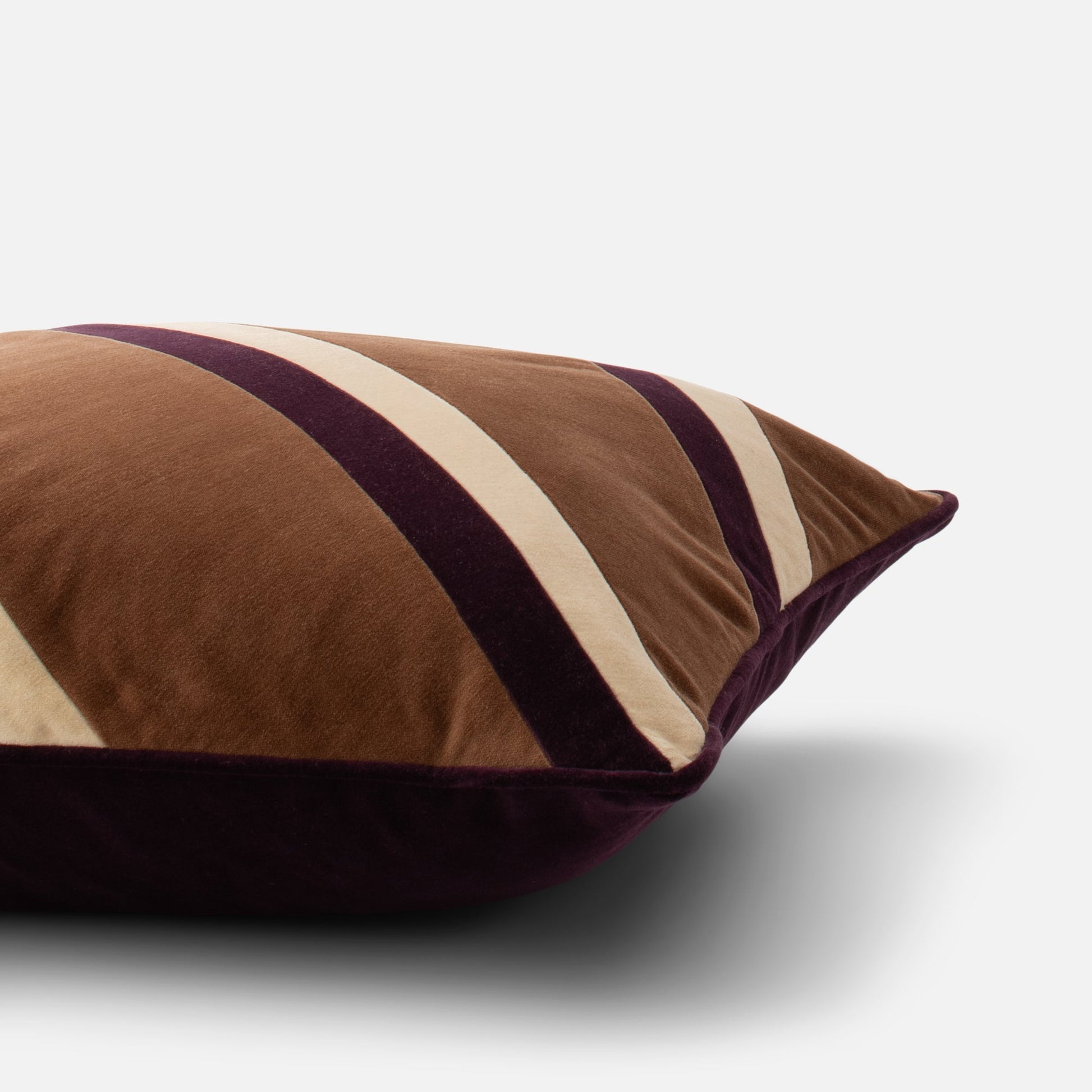 Close-up of Pieced Velvet Pillow Cover showing 100% cotton velvet texture and varsity-inspired stripes on white background