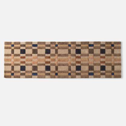 Top edge of Campus Wool Rug runner showcasing multicolor plaid check pattern and recessed pile on white background