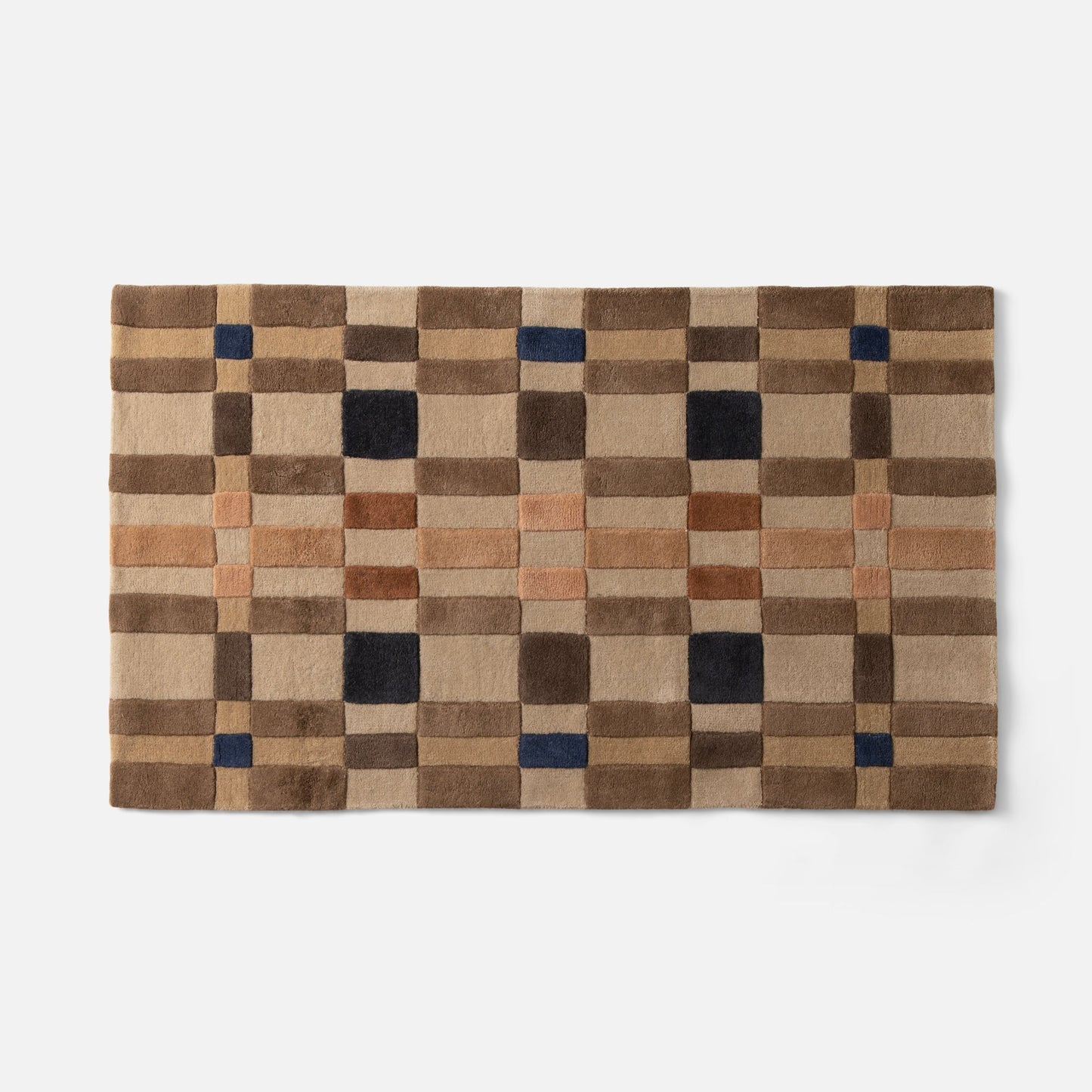 Top-edge view of Campus Wool Rug runner showcasing recessed-pile plaid squares in brown, tan, rust and navy on white background