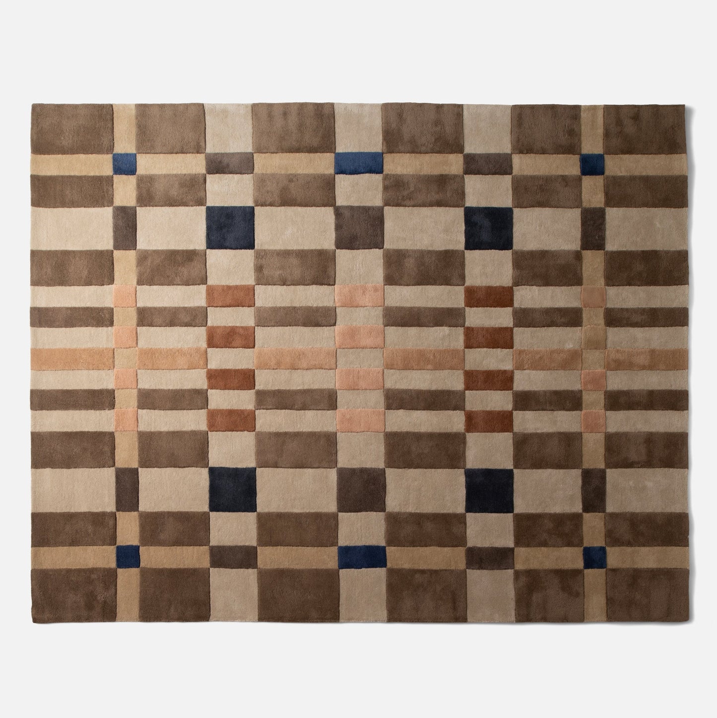 Top-down view of Campus Wool Rug showing recessed-pile plaid grid in brown, beige, rust, and navy on a white background