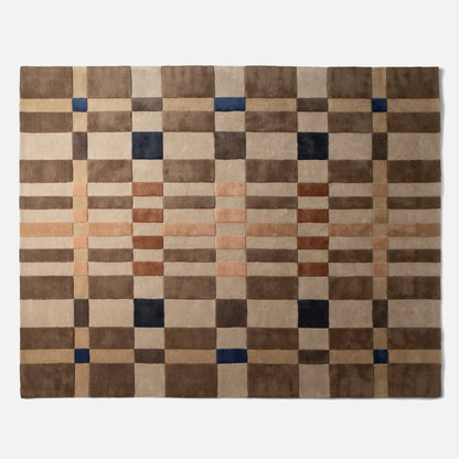 Top-down view of Campus Wool Rug showing recessed-pile plaid grid in brown, beige, rust, and navy on a white background