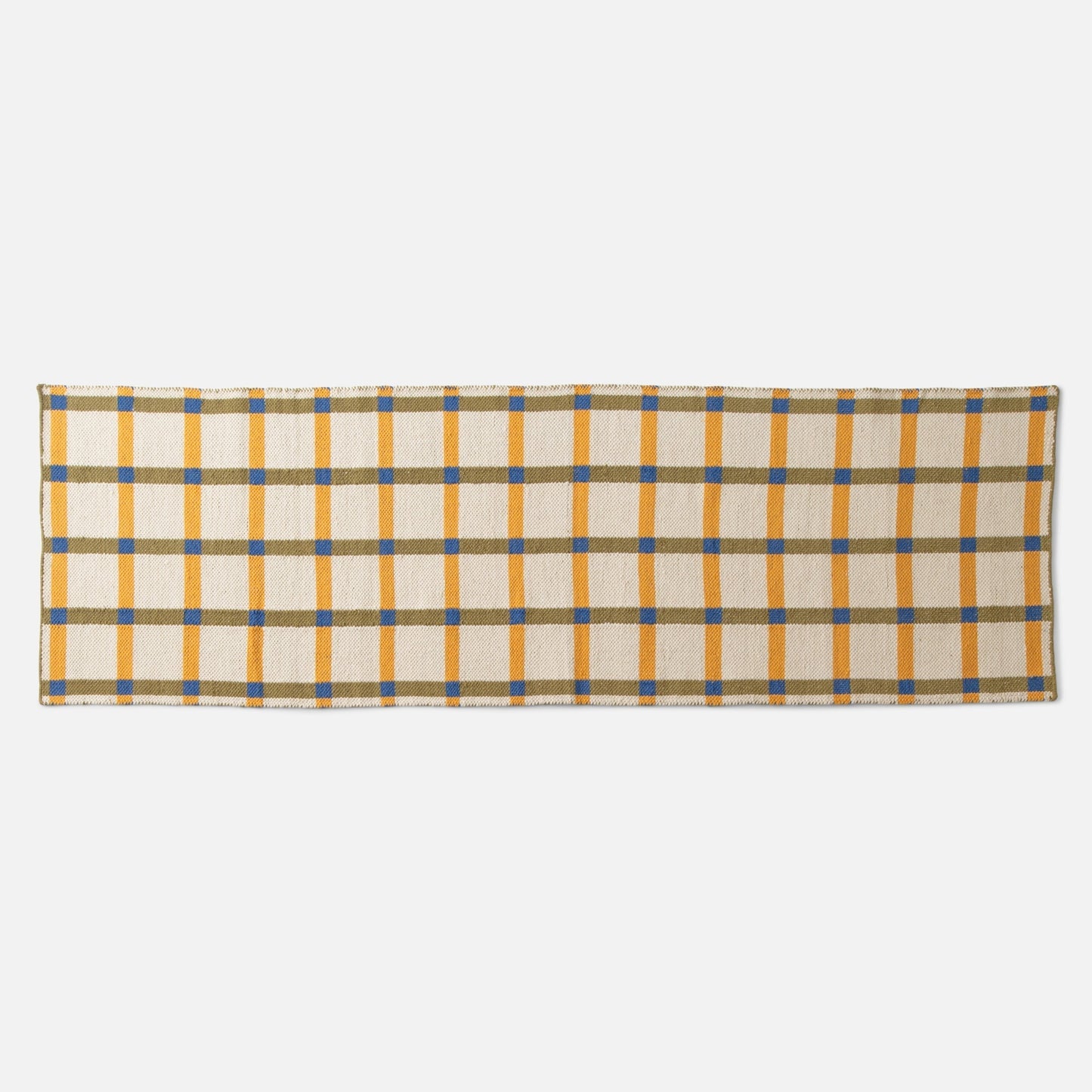 Top-edge view of Plaid Wool Reversible Rug showcasing woven yellow, olive, and blue plaid on a white studio background
