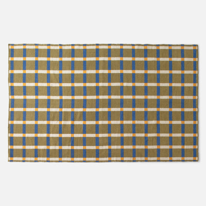 Top edge view of Plaid Wool Reversible Rug showcasing olive, blue, cream, and yellow plaid pattern on a white background