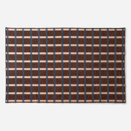 Top view of Plaid Wool Reversible Rug showcasing brown plaid with cream and blue stripes and stitched edge on a white background