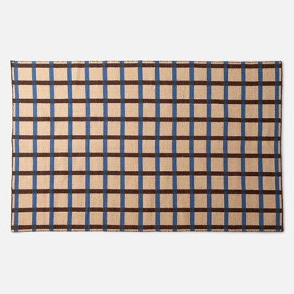 Top-down view of Plaid Wool Reversible Rug showing blue and brown plaid and woven wool texture on white background