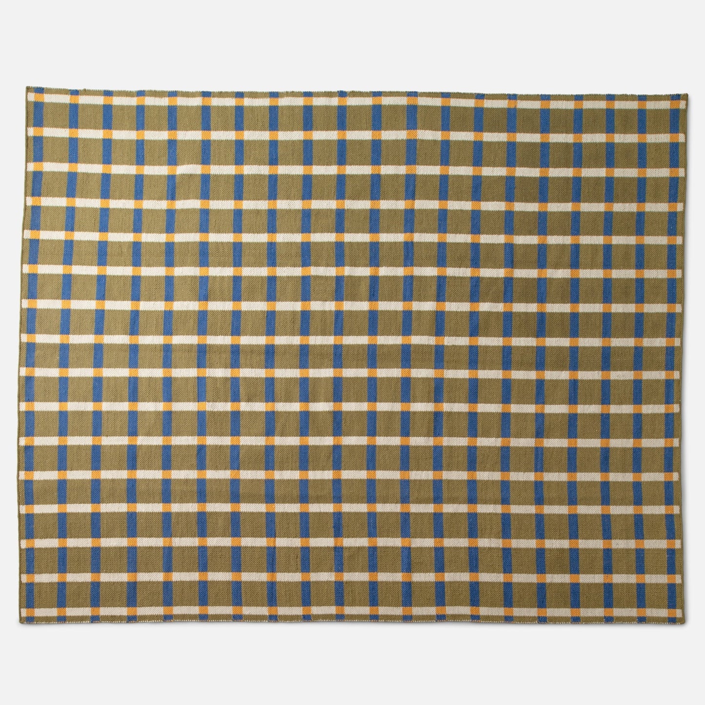 Flat lay of Plaid Wool Reversible Rug (olive) showcasing bold blue and yellow plaid and stitched edge on white background