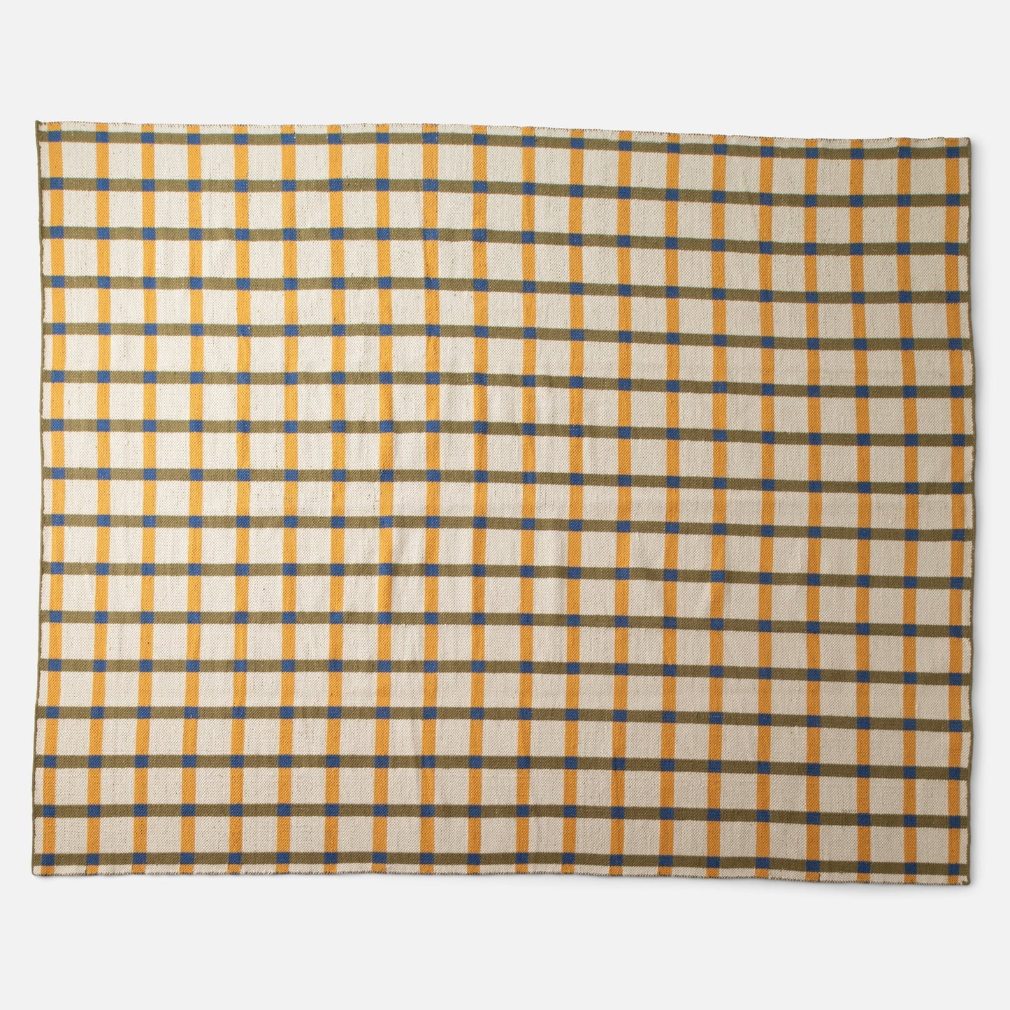 Overhead view of Plaid Wool Reversible Rug showcasing high-contrast yellow, olive, and blue plaid, handwoven from natural-dyed wool on a white studio background