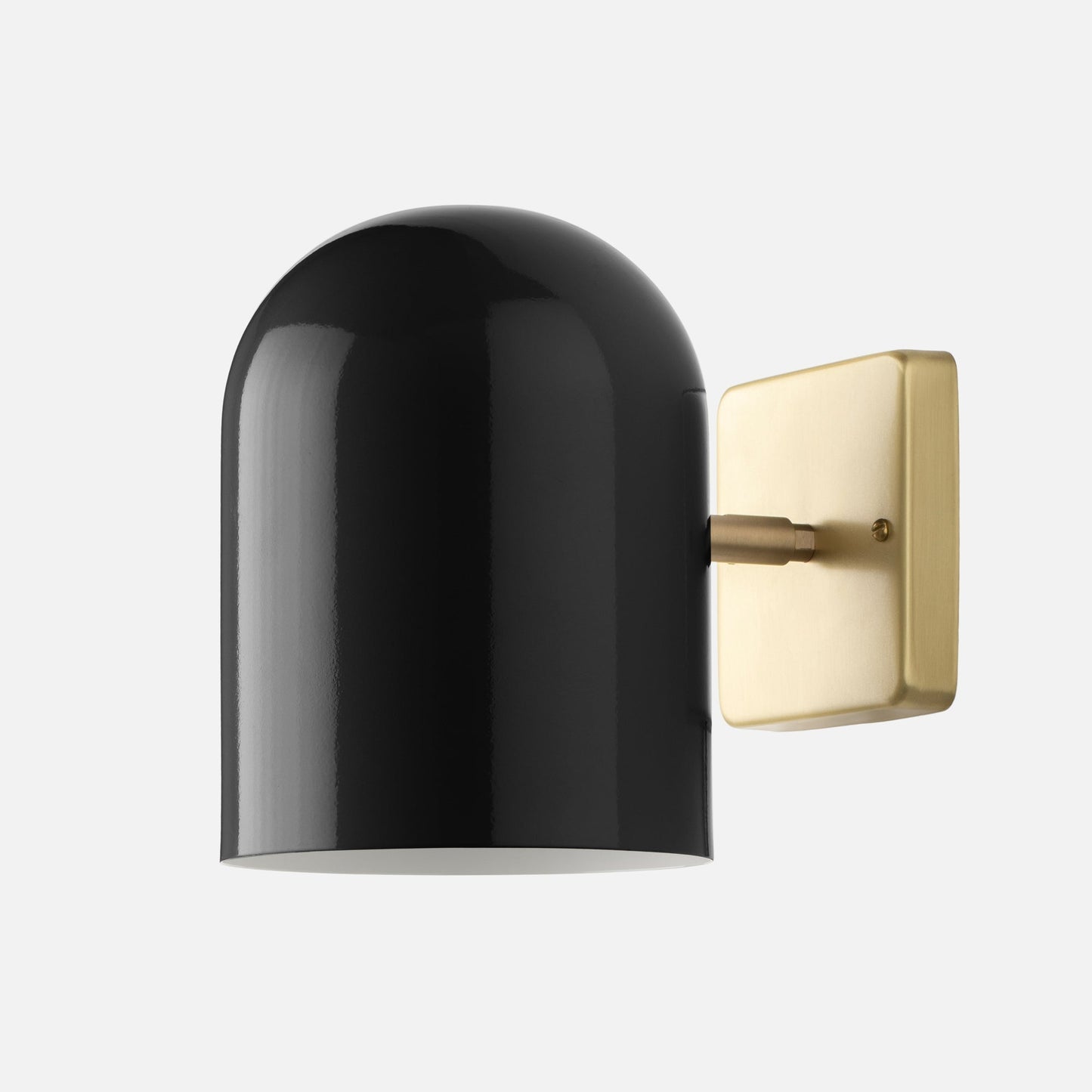 Side view of Allegheny Wall Sconce showcasing black gloss capsule shade and natural brass square backplate on light gray background