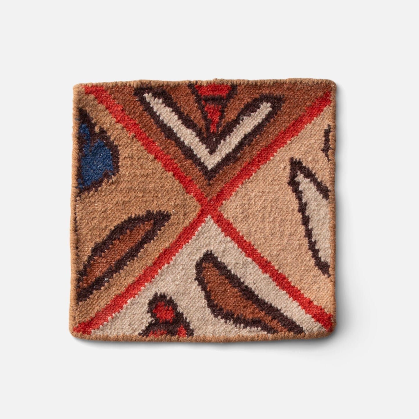 Close-up of Linnea Wool Flatweave Rug corner showing hand-drawn floral motifs and wool flatweave texture on white background