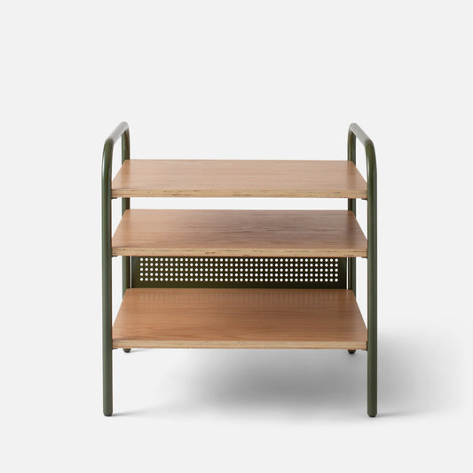 Front view of Miller Side Table with three oak veneer shelves and perforated steel back on white background