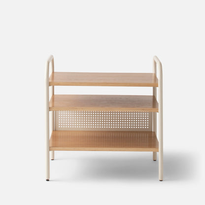 Front view of Miller Side Table showcasing three wood shelves and cream tubular metal frame on white background