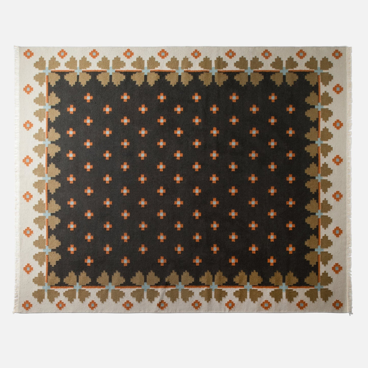 Top view of Flora Wool Flatweave Rug in black showcasing folk-floral pattern, flatweave wool texture on white background