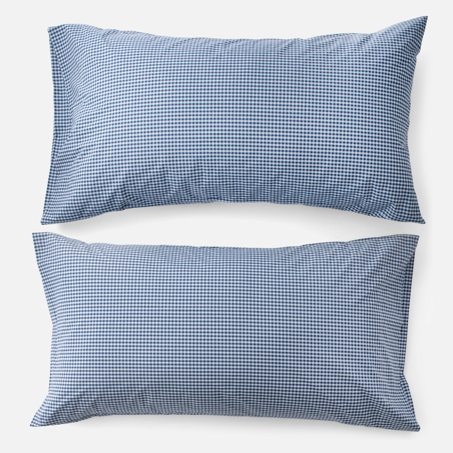 Top-down view of Gingham Percale king pillowcases showcasing navy gingham check on white background