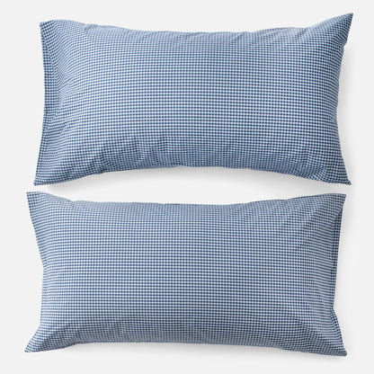 Top-down view of Gingham Percale king pillowcases showcasing navy gingham check on white background
