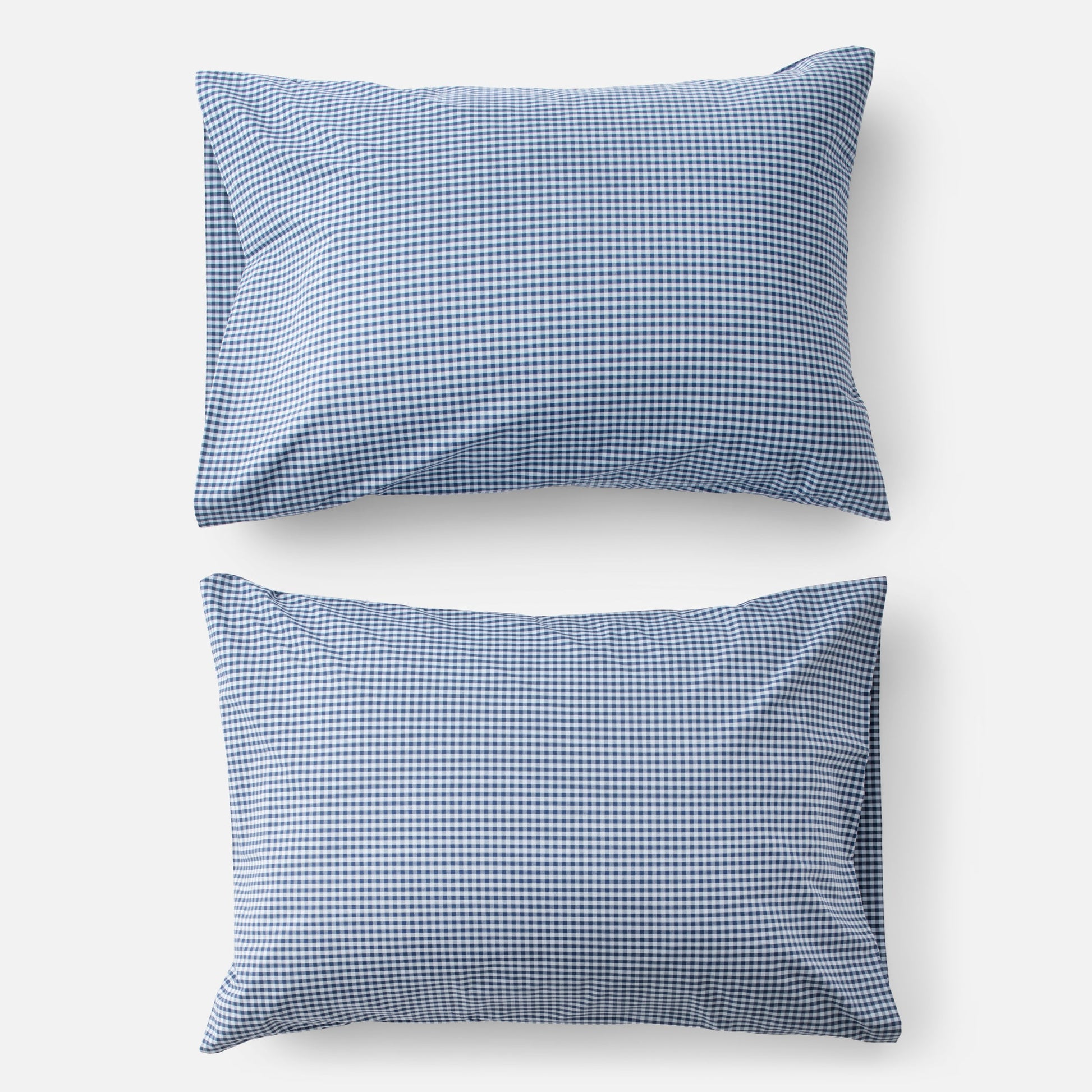 Top-down view of Gingham Pillowcase Set in navy showing small navy-and-white gingham check on white background