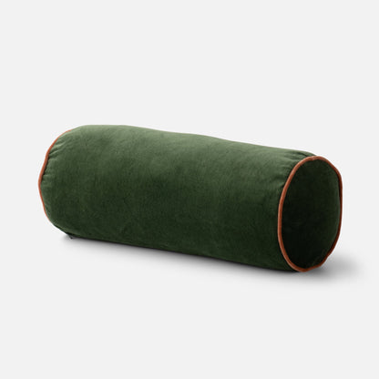 Close up of Velvet Piped Pillow bolster showing 100 percent cotton green velvet and rust piping on light gray background