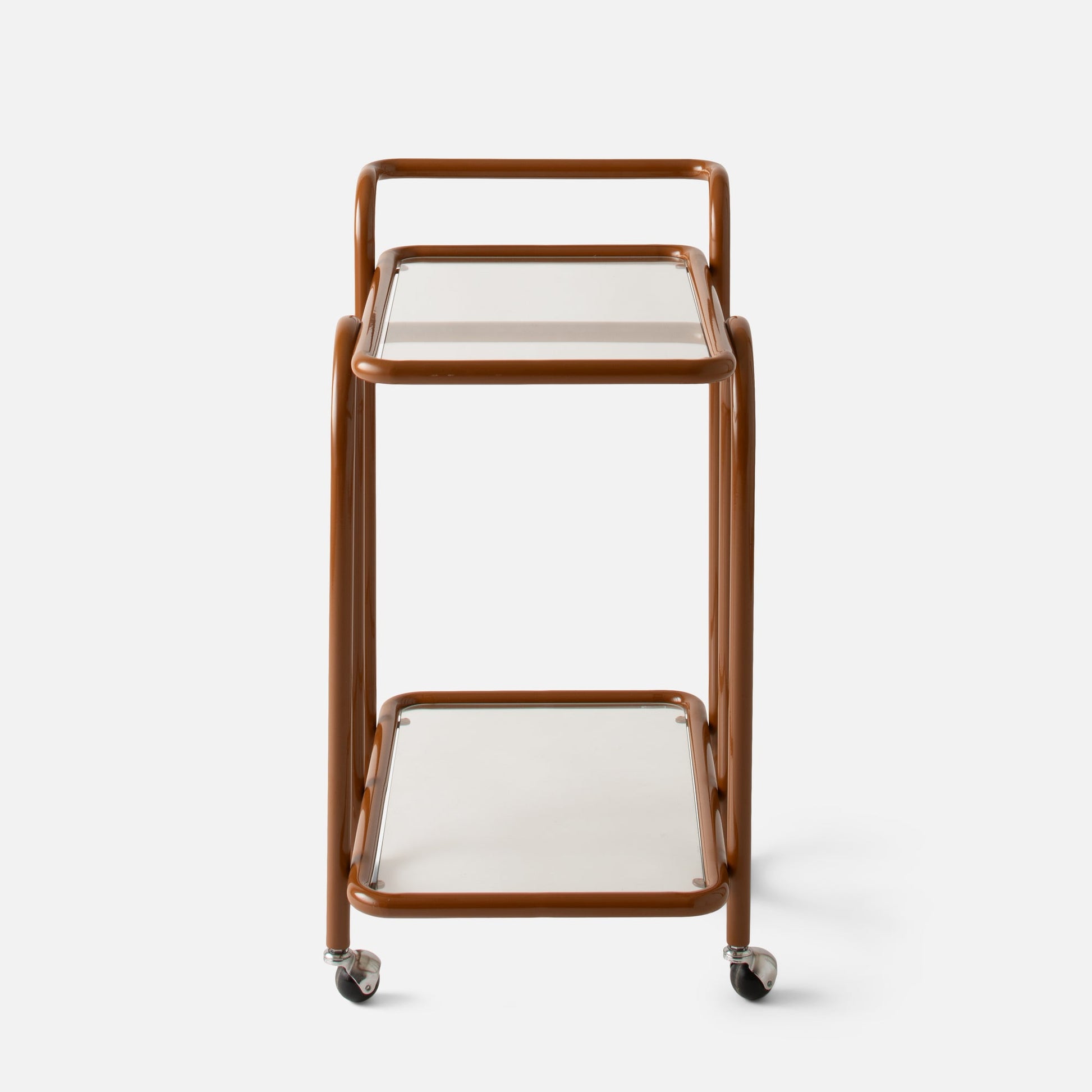 Front view of Lolly Bar Cart showing butterscotch bent steel frame, glass shelves and caster wheels on white background