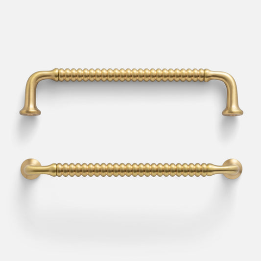 Front view of two Whittaker pulls showcasing beaded bar texture and satin brass finish on white background
