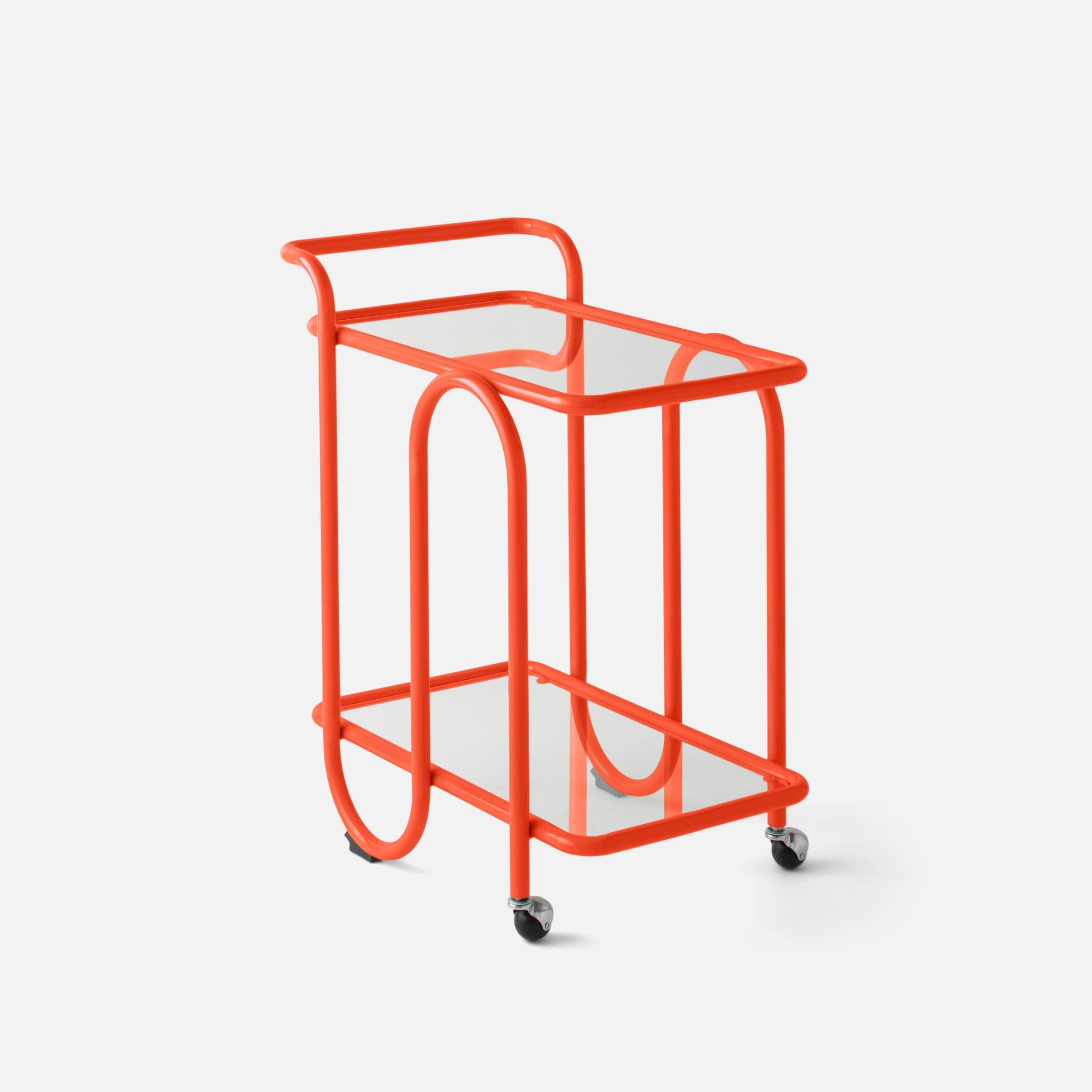 Three-quarter view of Lolly Bar Cart in persimmon showing bent steel frame, glass shelves, and caster wheels on white background