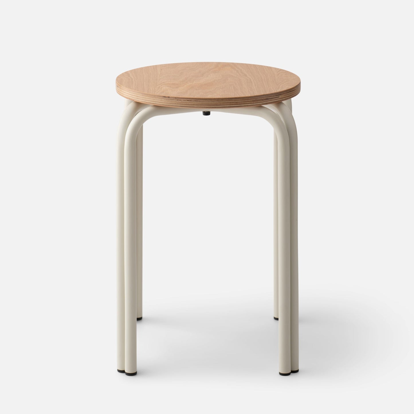 Front of Forma Stool showing round oak top with exposed plywood edge and cream powder-coated steel legs on white background