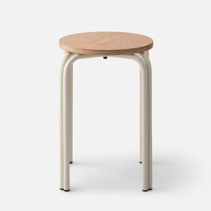 Front of Forma Stool showing round oak top with exposed plywood edge and cream powder-coated steel legs on white background