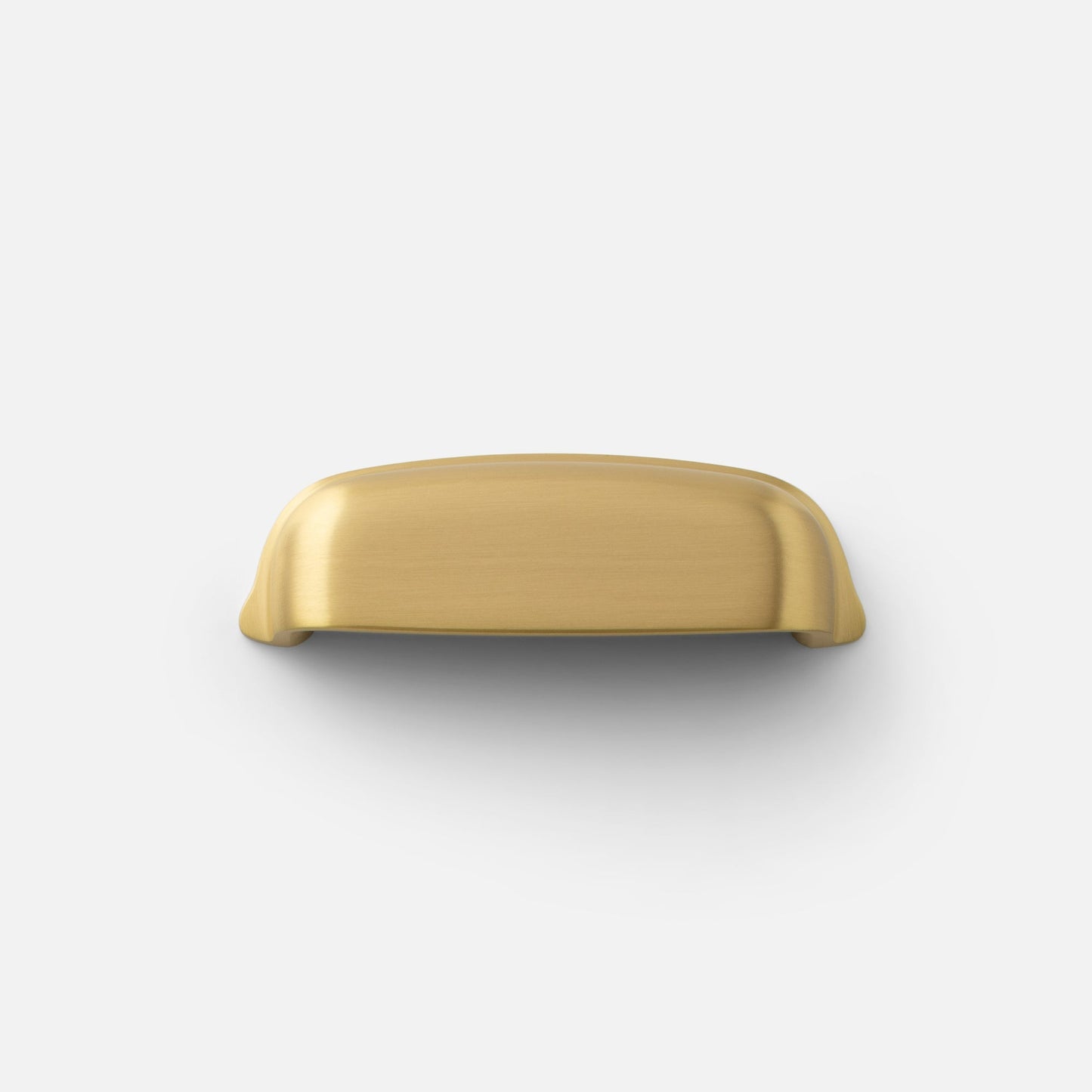 Top view of Darby cup pull showcasing brushed brass finish on white background