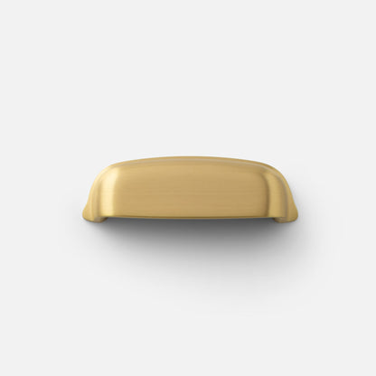 Top view of Darby cup pull showcasing brushed brass finish on white background
