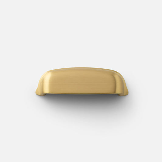 Top view of Darby cup pull showcasing brushed brass finish on white background