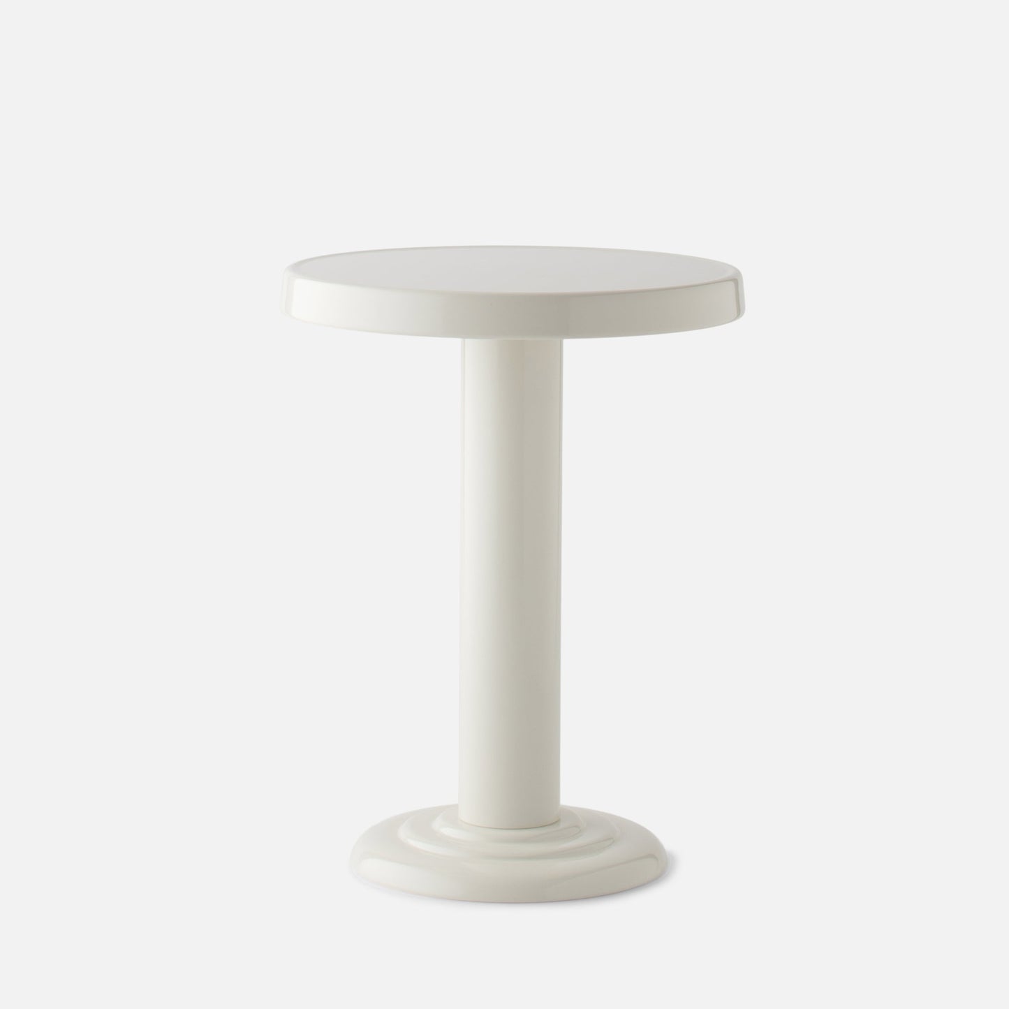 Front close-up of Owen Side Table showcasing its round top, single cylindrical pedestal, and glossy shell white finish on a plain white background