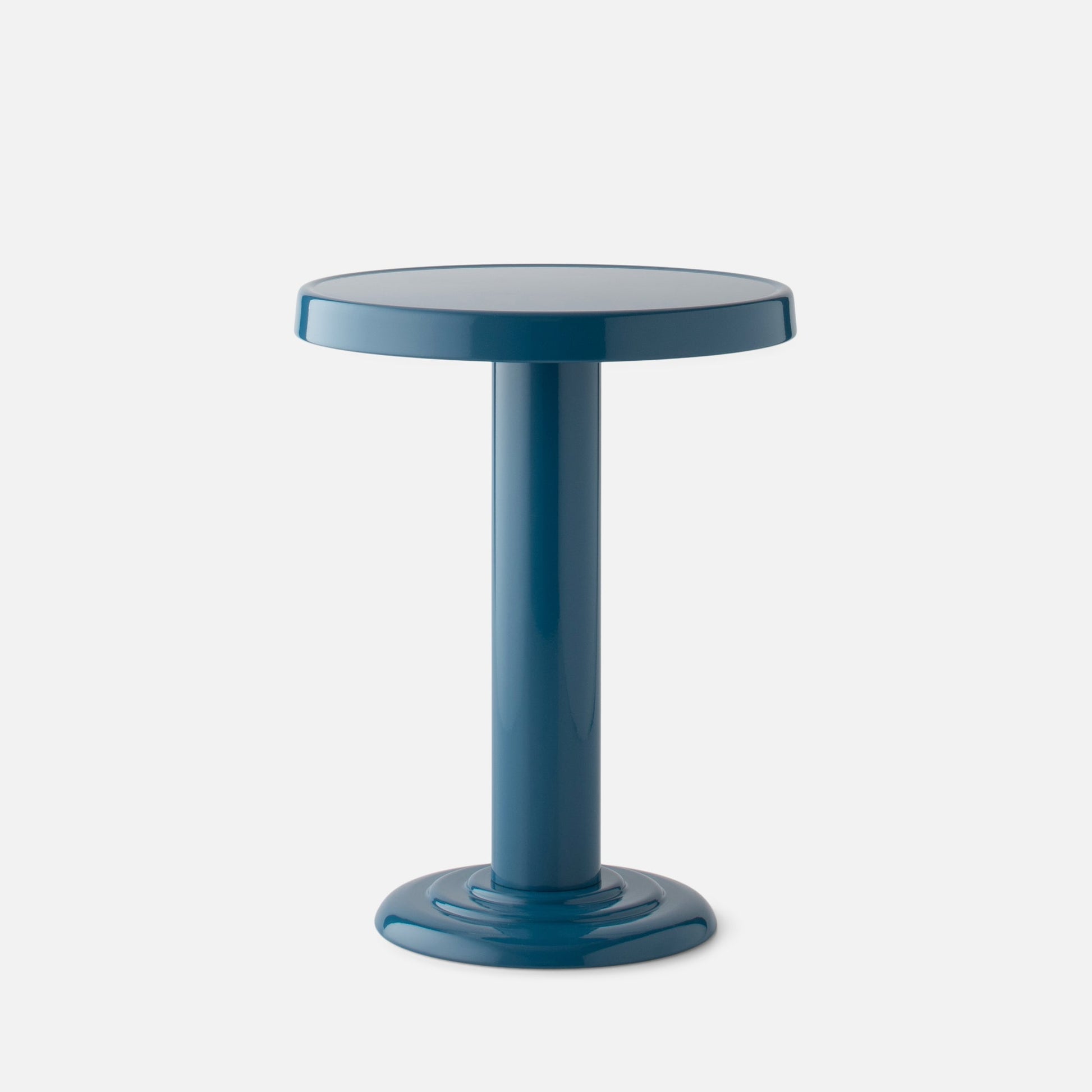 Close-up front view of Owen Side Table in Pool-Gloss showing round top and cylindrical base on light gray background