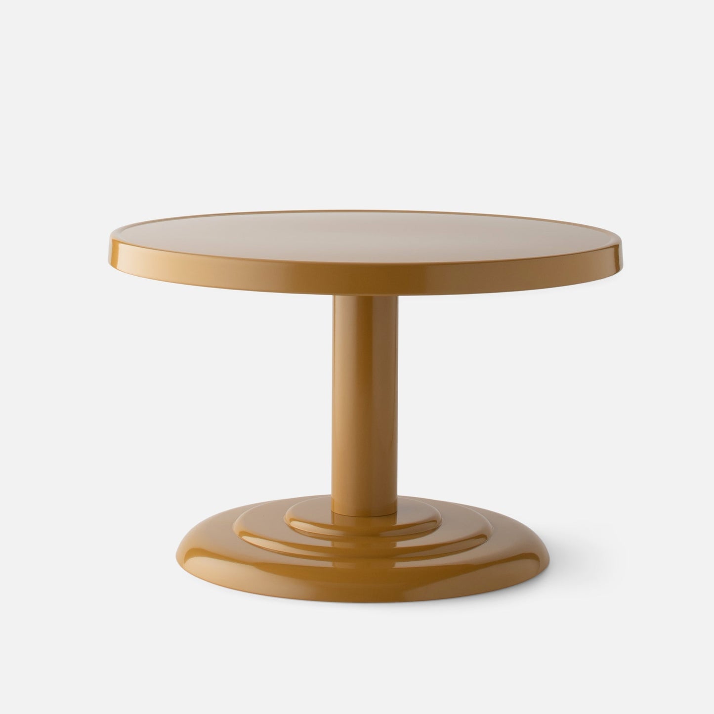 Front view of Owen Cocktail Table showcasing round tabletop and stepped pedestal base in dune gloss on light background