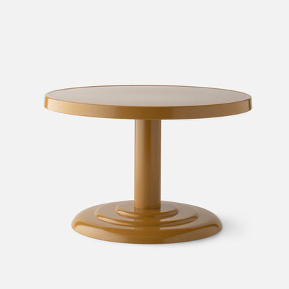 Front view of Owen Cocktail Table showcasing round tabletop and stepped pedestal base in dune gloss on light background