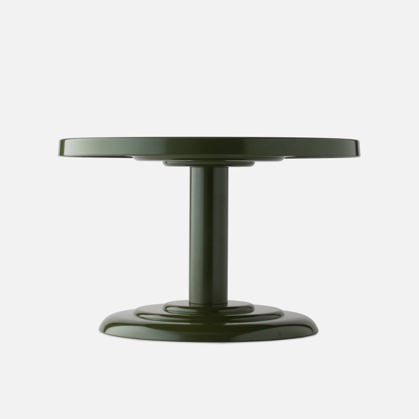 Low-angle front view of Owen Cocktail Table showcasing alder-gloss round top edge and central pedestal on white background