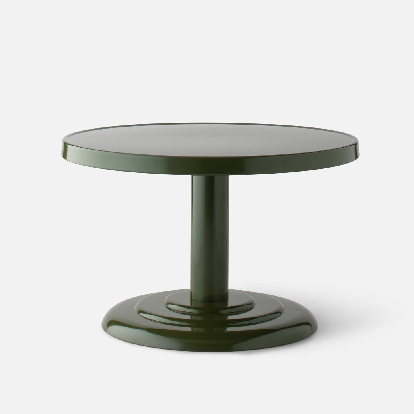 Front close-up of Owen Cocktail Table with round tabletop, stepped pedestal base and green gloss finish on light background