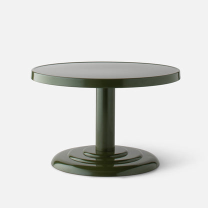 Front close-up of Owen Cocktail Table with round tabletop, stepped pedestal base and green gloss finish on light background