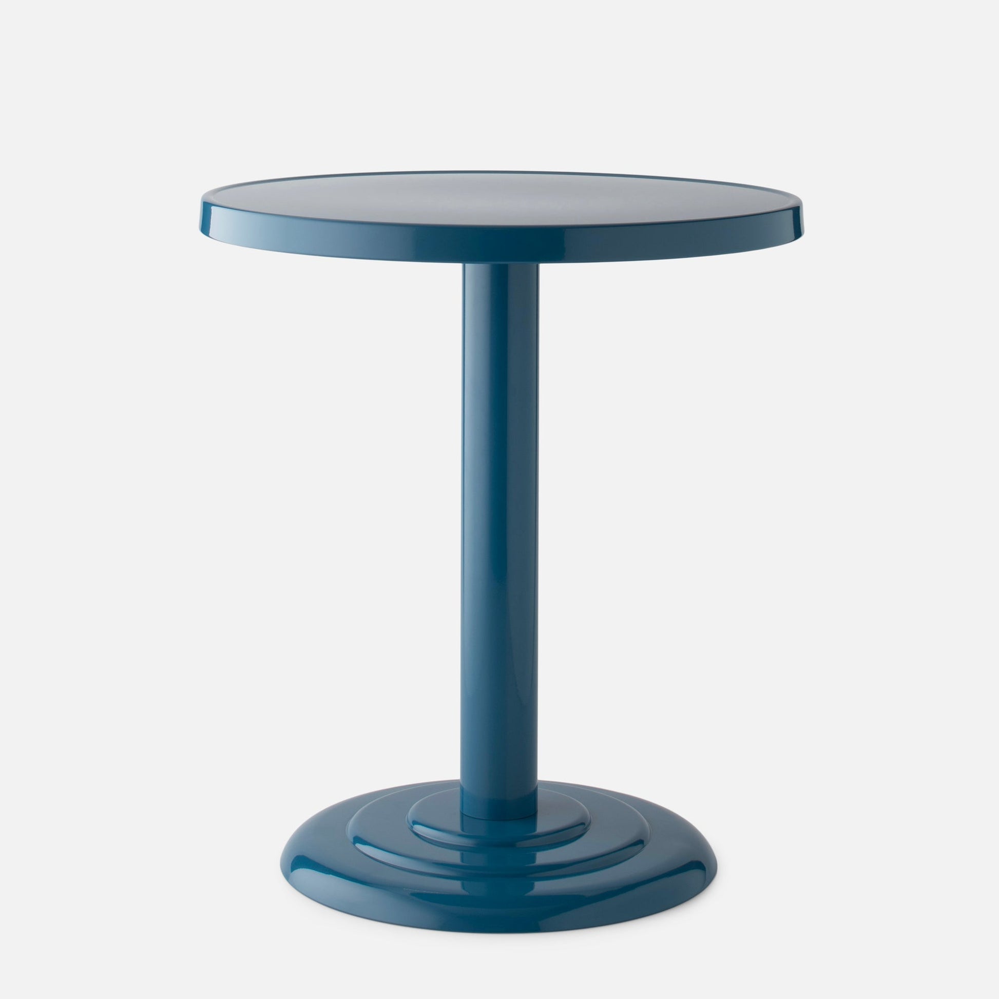 Front view of Owen Bistro Table with round top, pedestal and stepped base in pool gloss on gray background