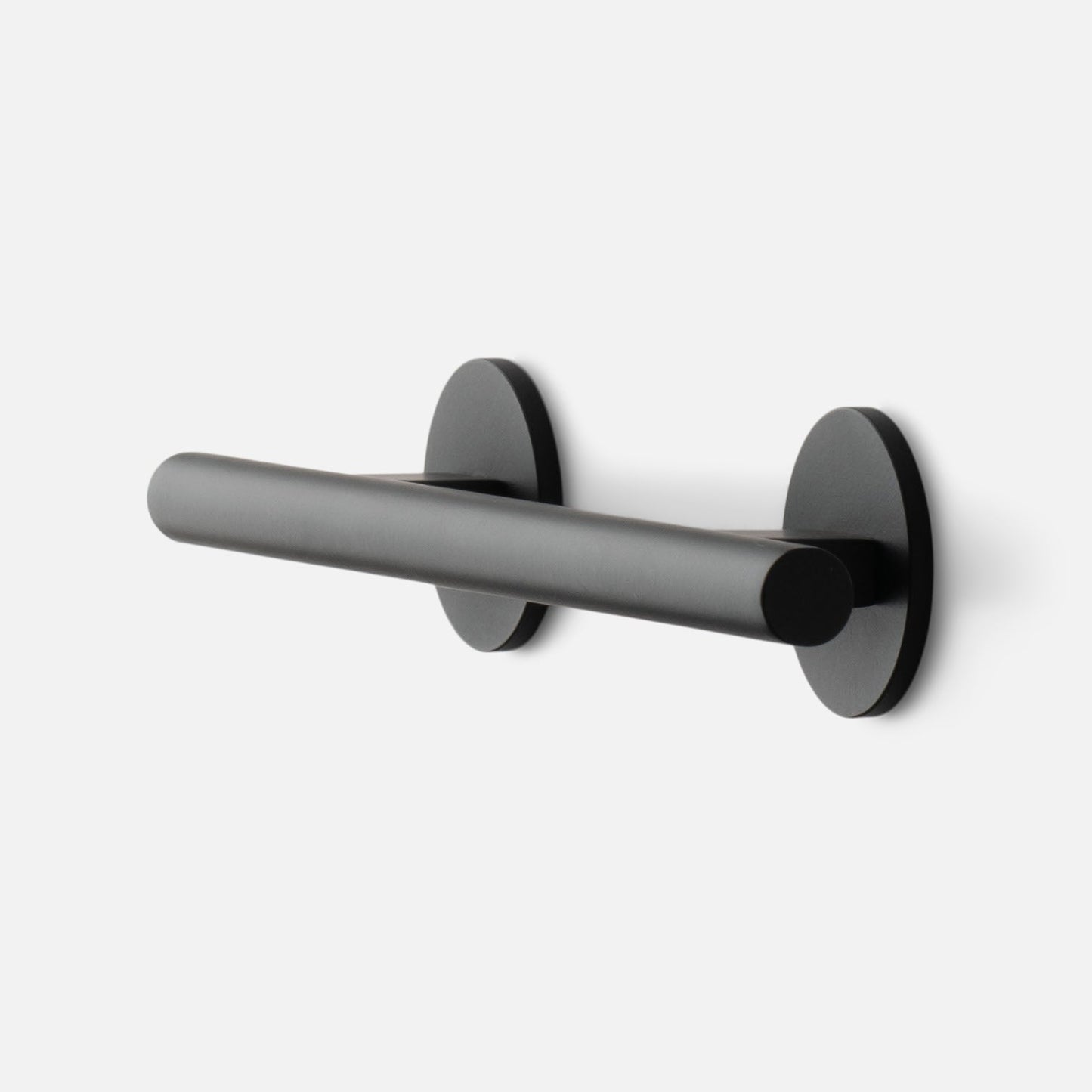 Angled side view of Galley Pull showcasing matte black cylindrical bar and round rosette mounts on white background