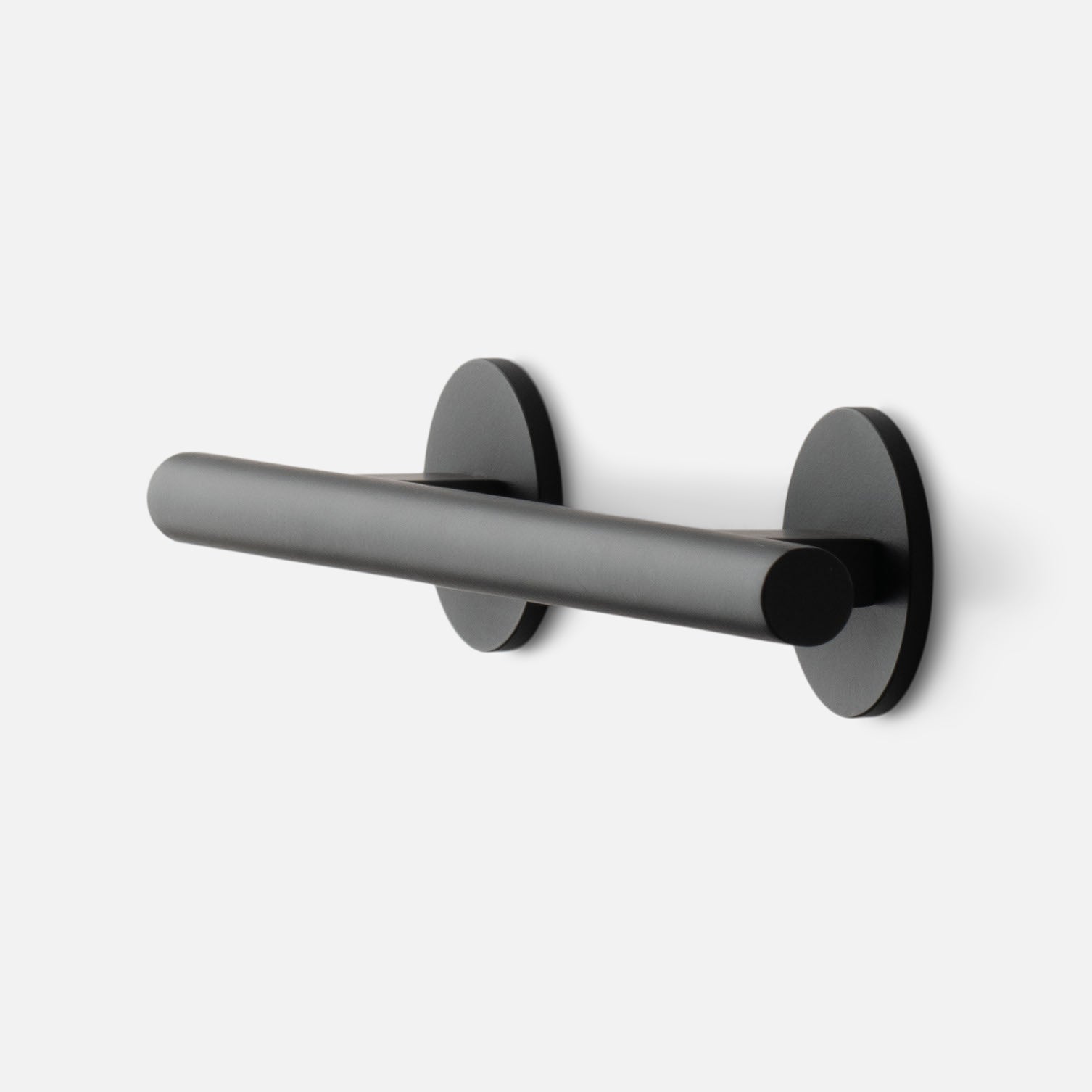Angled side view of Galley Pull showcasing matte black cylindrical bar and round rosette mounts on white background
