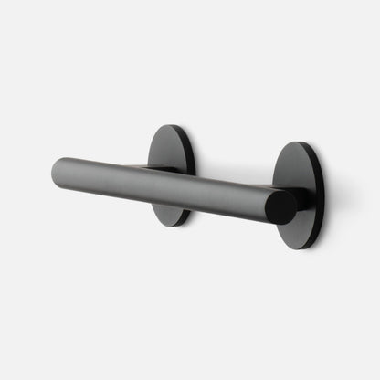 Angled side view of Galley Pull showcasing matte black cylindrical bar and round rosette mounts on white background
