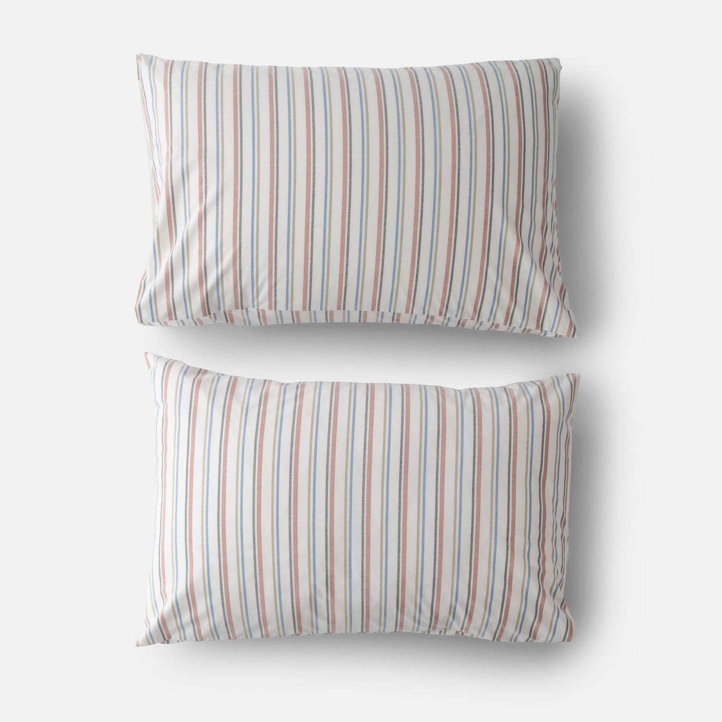 Top view of two Fresh Stripe percale pillowcases with blue and rust vertical stripes on white background